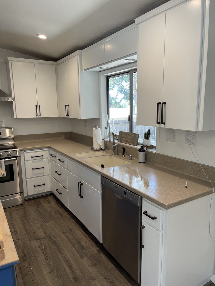 Modern kitchen cabinet painting in a Monterey County home